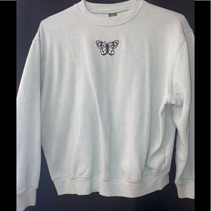 Size Extra Small, Light green with white and black butterfly on front